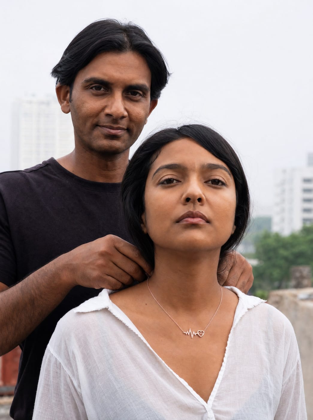 A couple sharing a warm TITLI pendant moment outdoors