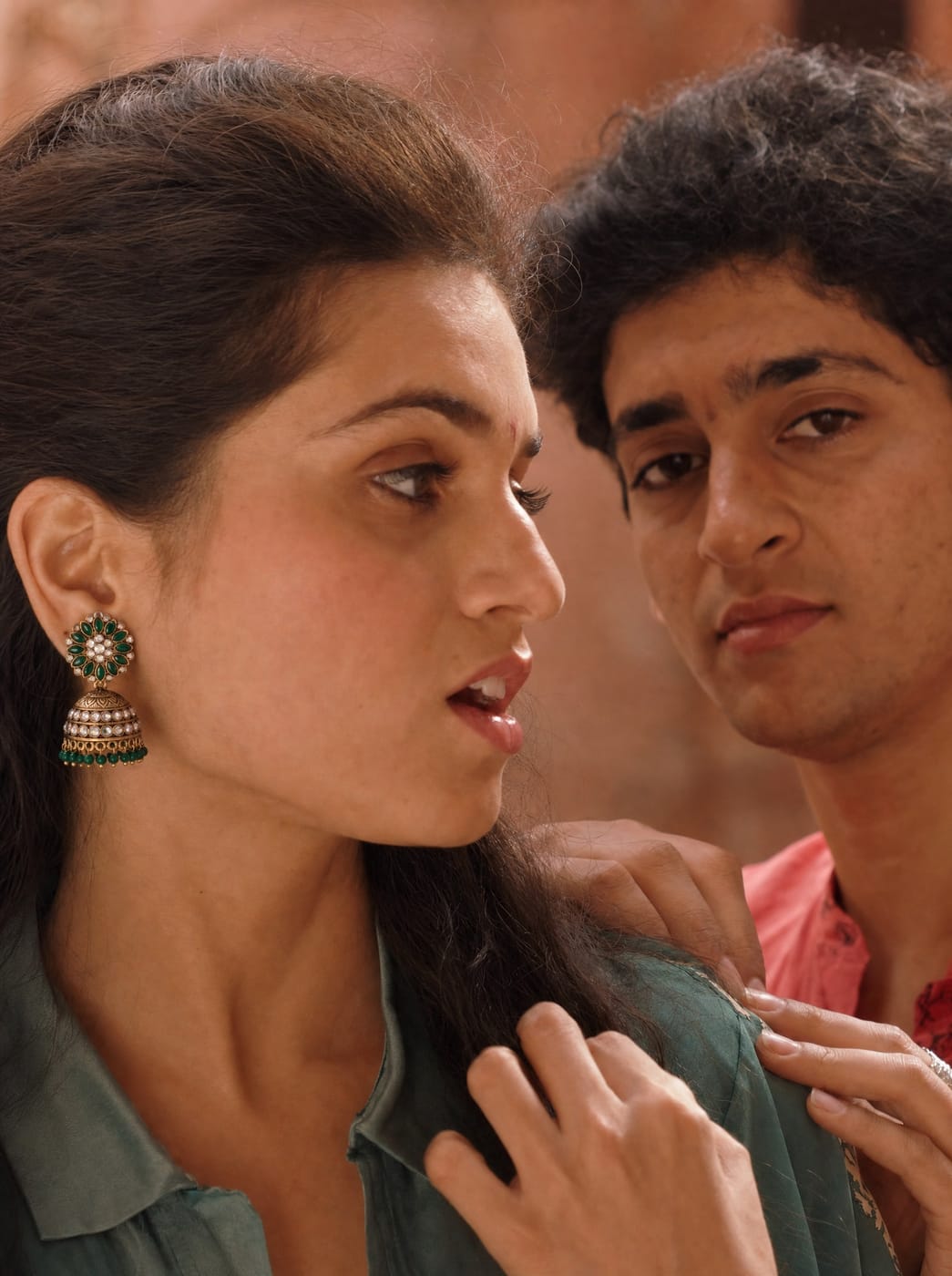 Indian woman wearing emerald floral TITLI jhumkas